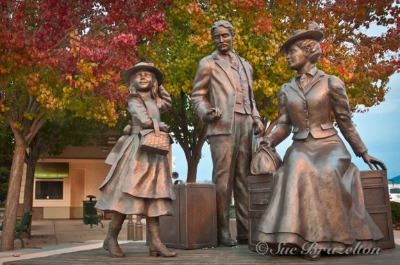 Waiting for the Train Lifesize Bronze Sculpture by Trainstation by Marlene Amerian
