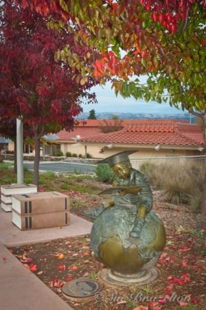 Knowledge is Power Bronze Sculpture in Front of Library