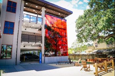 Poppy Jasper Illuminated Wall on Parking Garage