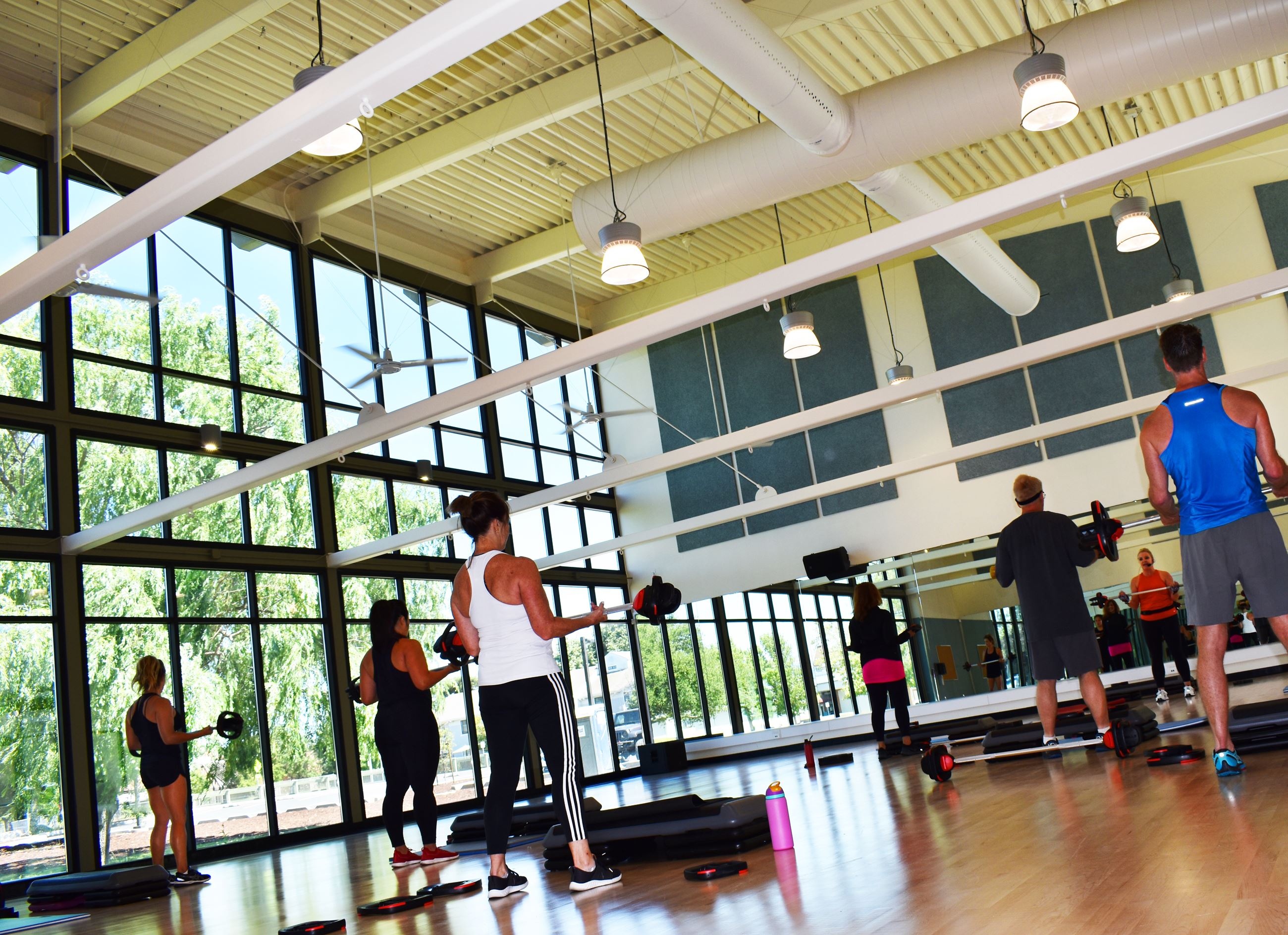 Group of adults taking a fitness weights class at CRC